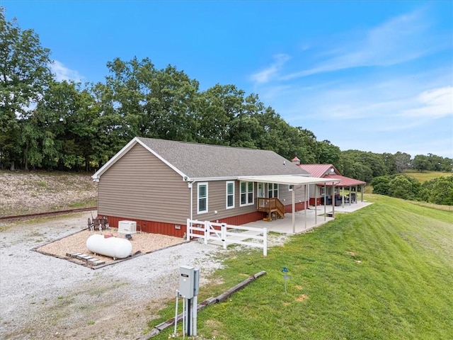 21018 Farm Rd Unit 2260, Eagle Rock, MO 65641 - view of front facade featuring a patio and a front yard