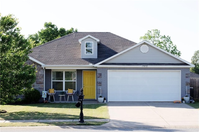 15072 White Fawn Dr, Garfield, AR 72732 - view of front of house with covered porch, a garage, concrete driveway, a front lawn, and roof with shingles