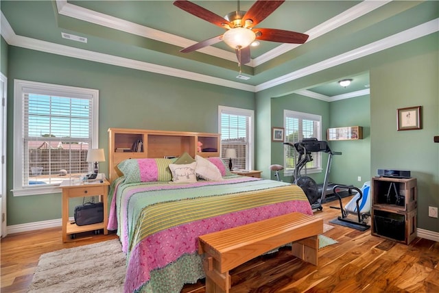 460 Viney Grove Rd, Prairie Grove, AR 72753 - bedroom featuring a raised ceiling, wood finished floors, ornamental molding, and ceiling fan