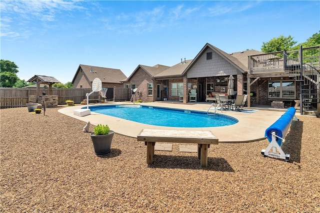 460 Viney Grove Rd, Prairie Grove, AR 72753 - view of swimming pool featuring stairs, a fenced backyard, and a patio area