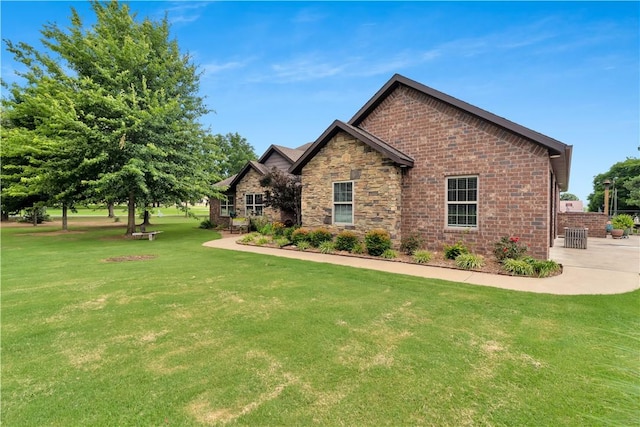 460 Viney Grove Rd, Prairie Grove, AR 72753 - view of front facade with a front lawn, stone siding, and brick siding