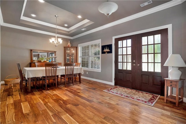460 Viney Grove Rd, Prairie Grove, AR 72753 - dining space with a chandelier, wood finished floors, crown molding, a raised ceiling, and french doors