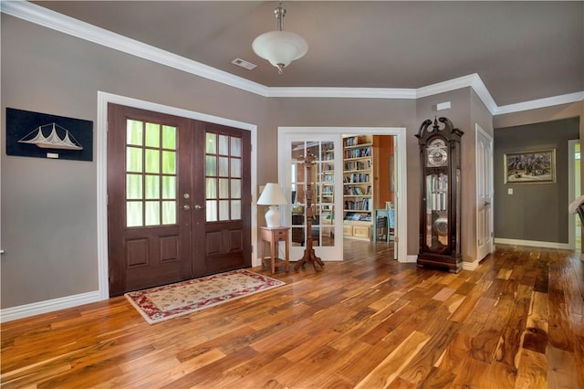 460 Viney Grove Rd, Prairie Grove, AR 72753 - foyer featuring french doors, wood finished floors, and ornamental molding
