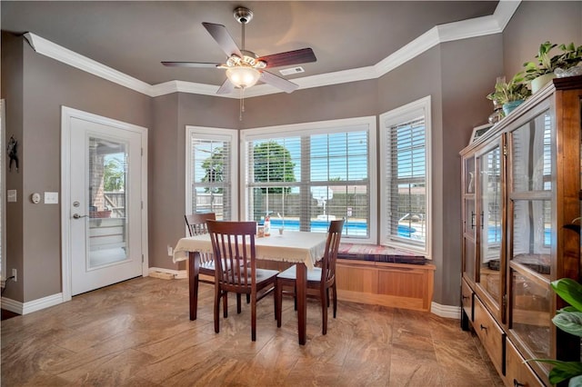 460 Viney Grove Rd, Prairie Grove, AR 72753 - dining room featuring healthy amount of natural light, crown molding, and a ceiling fan