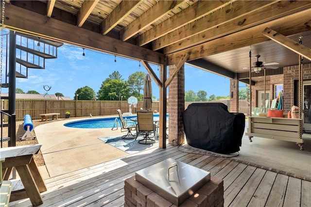 460 Viney Grove Rd, Prairie Grove, AR 72753 - deck with a fenced backyard, a ceiling fan, a patio, and grilling area