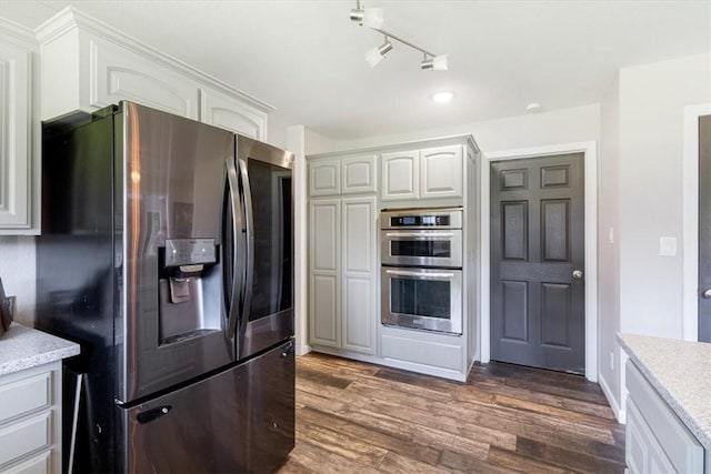 2042 Greasy Creek Ln, Washburn, MO 65772 - kitchen with refrigerator with ice dispenser, stainless steel double oven, dark wood-style floors, white cabinetry, and rail lighting
