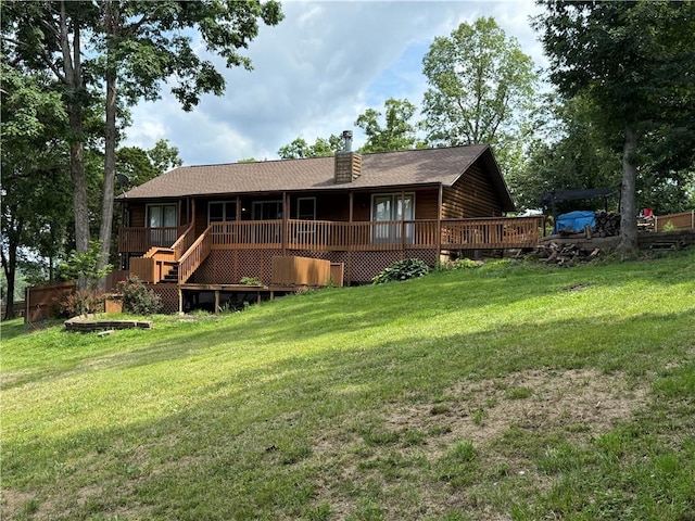 14076 Canal St, Rogers, AR 72758 - back of house featuring a chimney, a yard, and a wooden deck