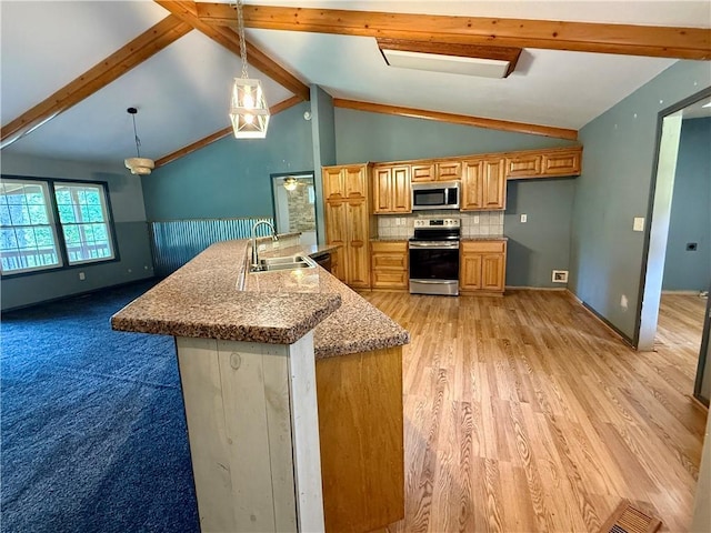 14076 Canal St, Rogers, AR 72758 - kitchen with stainless steel appliances, beam ceiling, decorative light fixtures, tasteful backsplash, and light wood-style flooring