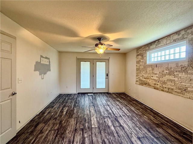 14076 Canal St, Rogers, AR 72758 - unfurnished room with ceiling fan, a textured ceiling, and dark wood-type flooring