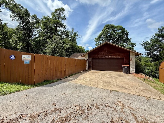 14076 Canal St, Rogers, AR 72758 - garage featuring driveway