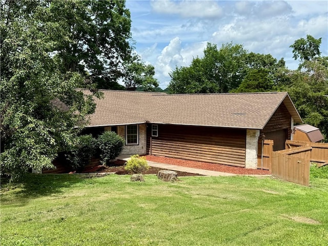 14076 Canal St, Rogers, AR 72758 - rear view of house featuring roof with shingles, stone siding, and a detached garage