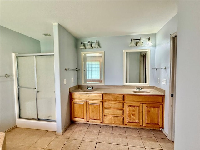 14076 Canal St, Rogers, AR 72758 - bathroom with a shower stall, tile patterned flooring, and double vanity