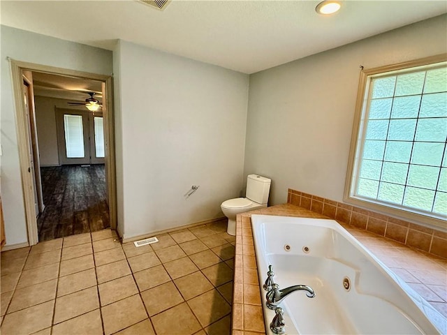 14076 Canal St, Rogers, AR 72758 - full bath with a tub with jets, tile patterned flooring, and ceiling fan