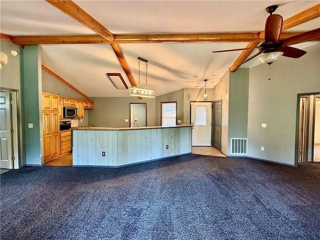 14076 Canal St, Rogers, AR 72758 - kitchen with stainless steel microwave, light carpet, a ceiling fan, a center island with sink, and pendant lighting