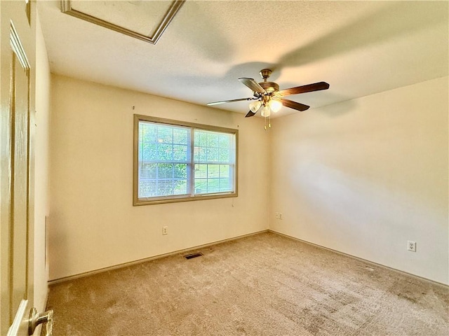 14076 Canal St, Rogers, AR 72758 - spare room with carpet, ceiling fan, and a textured ceiling