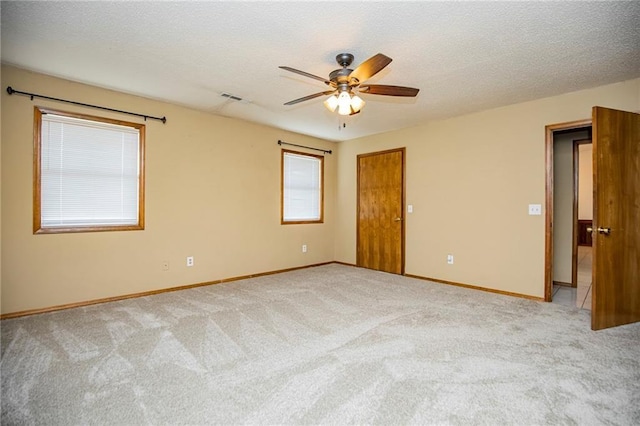 5315 Walden St, Lowell, AR 72745 - empty room with light colored carpet, ceiling fan, and a textured ceiling