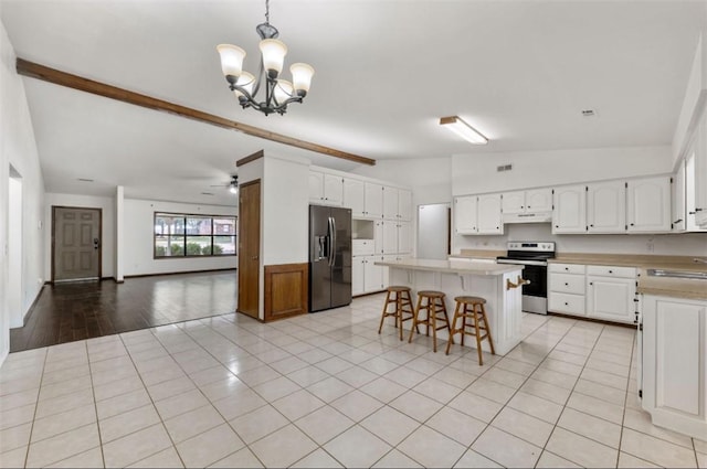 5315 Walden St, Lowell, AR 72745 - kitchen featuring appliances with stainless steel finishes, a chandelier, open floor plan, and light countertops