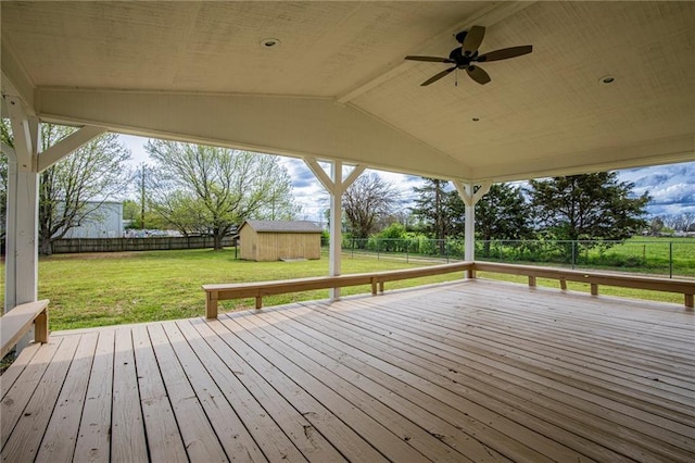 5315 Walden St, Lowell, AR 72745 - deck with ceiling fan, a fenced backyard, and a storage shed