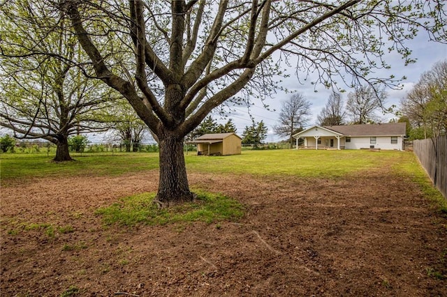 5315 Walden St, Lowell, AR 72745 - view of yard featuring a storage unit