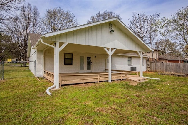 5315 Walden St, Lowell, AR 72745 - rear view of house with brick siding and a wooden deck