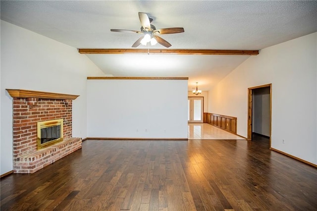 5315 Walden St, Lowell, AR 72745 - unfurnished living room featuring wood finished floors, ceiling fan, a brick fireplace, and a chandelier