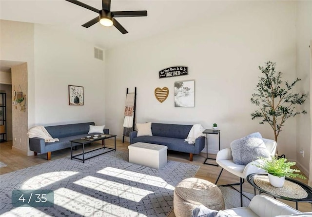5 Horseshoe Dr, Holiday Island, AR 72631 - living area with wood finished floors, ceiling fan, and high vaulted ceiling