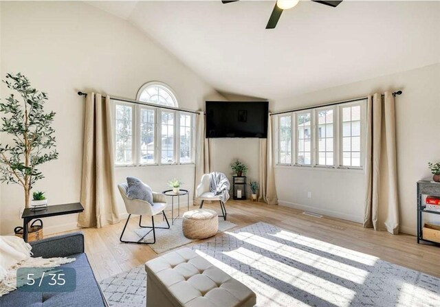 5 Horseshoe Dr, Holiday Island, AR 72631 - sitting room with plenty of natural light, vaulted ceiling, wood finished floors, and a ceiling fan