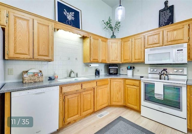 5 Horseshoe Dr, Holiday Island, AR 72631 - kitchen featuring white appliances, tasteful backsplash, light wood-type flooring, decorative light fixtures, and light brown cabinets