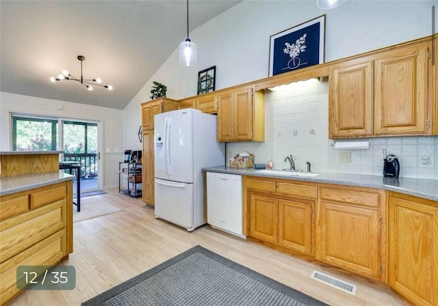 5 Horseshoe Dr, Holiday Island, AR 72631 - kitchen featuring white appliances, a chandelier, backsplash, light countertops, and pendant lighting