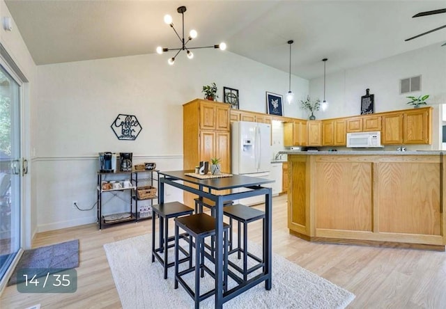 5 Horseshoe Dr, Holiday Island, AR 72631 - dining area with light wood-style flooring, high vaulted ceiling, a chandelier, and ceiling fan