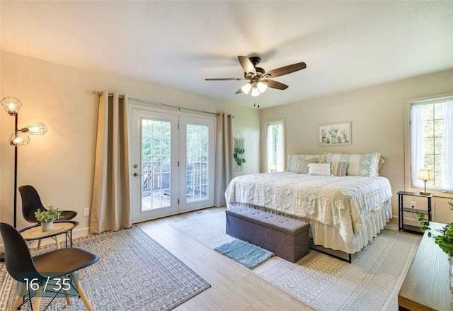 5 Horseshoe Dr, Holiday Island, AR 72631 - bedroom with access to exterior, wood finished floors, and a ceiling fan