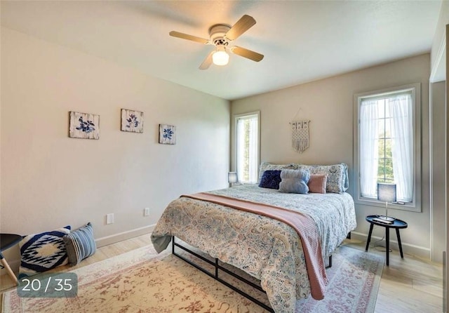 5 Horseshoe Dr, Holiday Island, AR 72631 - bedroom with light wood-type flooring and ceiling fan