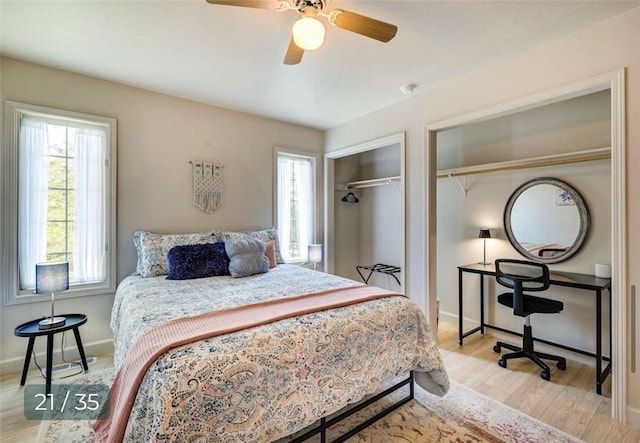 5 Horseshoe Dr, Holiday Island, AR 72631 - bedroom with wood finished floors, multiple closets, and a ceiling fan