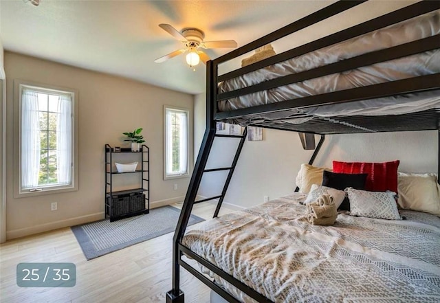 5 Horseshoe Dr, Holiday Island, AR 72631 - bedroom featuring multiple windows and wood finished floors