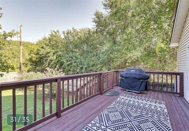5 Horseshoe Dr, Holiday Island, AR 72631 - wooden terrace with area for grilling and a lawn