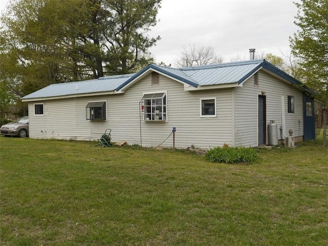 1042 County Road 445, Berryville, AR 72616 - view of side of home featuring a yard and a metal roof