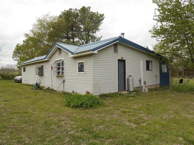 1042 County Road 445, Berryville, AR 72616 - rear view of house featuring a lawn