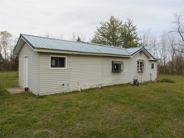 1042 County Road 445, Berryville, AR 72616 - view of home's exterior featuring a lawn and a metal roof