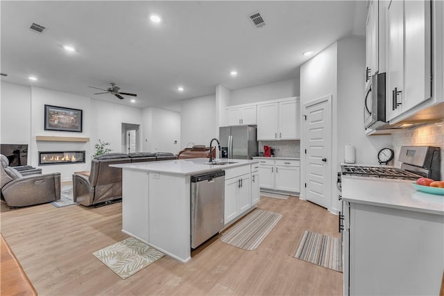 276 N Yona Ln, Farmington, AR 72730 - kitchen featuring stainless steel appliances, open floor plan, ceiling fan, light countertops, and recessed lighting
