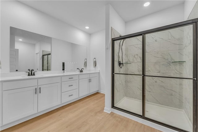 276 N Yona Ln, Farmington, AR 72730 - bathroom with a marble finish shower, wood finished floors, double vanity, and recessed lighting