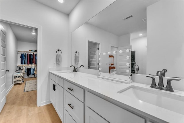 276 N Yona Ln, Farmington, AR 72730 - full bath with double vanity, wood finished floors, and a walk in closet