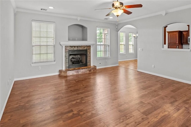 4788 Soapstone Dr, Fayetteville, AR 72704 - unfurnished living room featuring ceiling fan, ornamental molding, wood finished floors, a tile fireplace, and recessed lighting