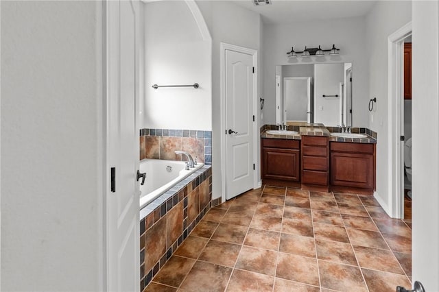 4788 Soapstone Dr, Fayetteville, AR 72704 - bathroom featuring a garden tub and double vanity