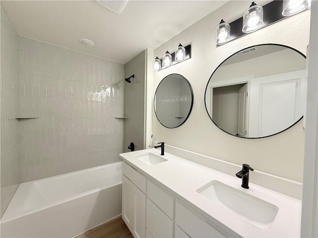 1215 John Renfro Rd, Pea Ridge, AR 72751 - full bath featuring shower / bath combination, double vanity, and wood finished floors