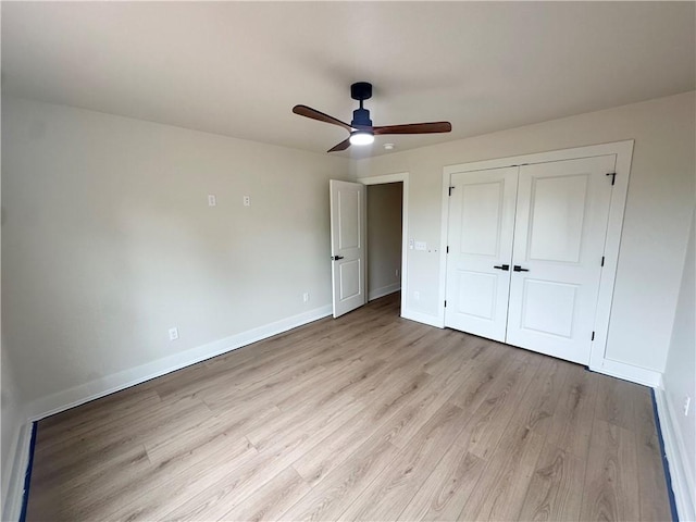 1215 John Renfro Rd, Pea Ridge, AR 72751 - unfurnished bedroom featuring light wood-style floors, a closet, and a ceiling fan