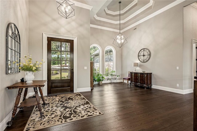 8 Mckenzie Way, Bella Vista, AR 72715 - entrance foyer with a high ceiling, a chandelier, dark wood finished floors, a raised ceiling, and ornamental molding