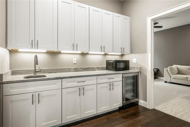 8 Mckenzie Way, Bella Vista, AR 72715 - kitchen featuring wine cooler, black microwave, and white cabinets