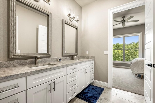 8 Mckenzie Way, Bella Vista, AR 72715 - bathroom featuring double vanity, a ceiling fan, ensuite bathroom, and tile patterned flooring