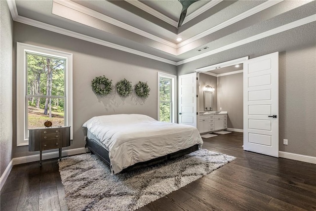 8 Mckenzie Way, Bella Vista, AR 72715 - bedroom featuring dark wood finished floors, crown molding, a tray ceiling, ensuite bath, and recessed lighting