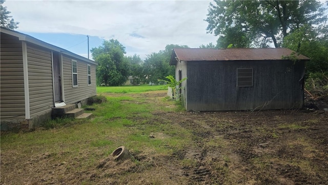 4436 State Highway 288, Subiaco, AR 72865 - view of yard featuring entry steps and an outdoor structure